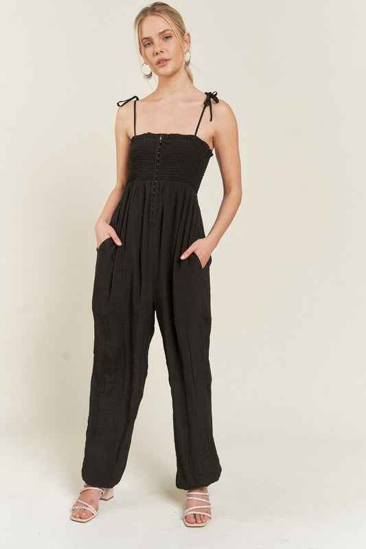 SMOCKED TIE STRAP JUMPSUIT